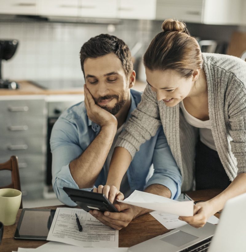 Home budgeting Photo of a young couple calculating home finances